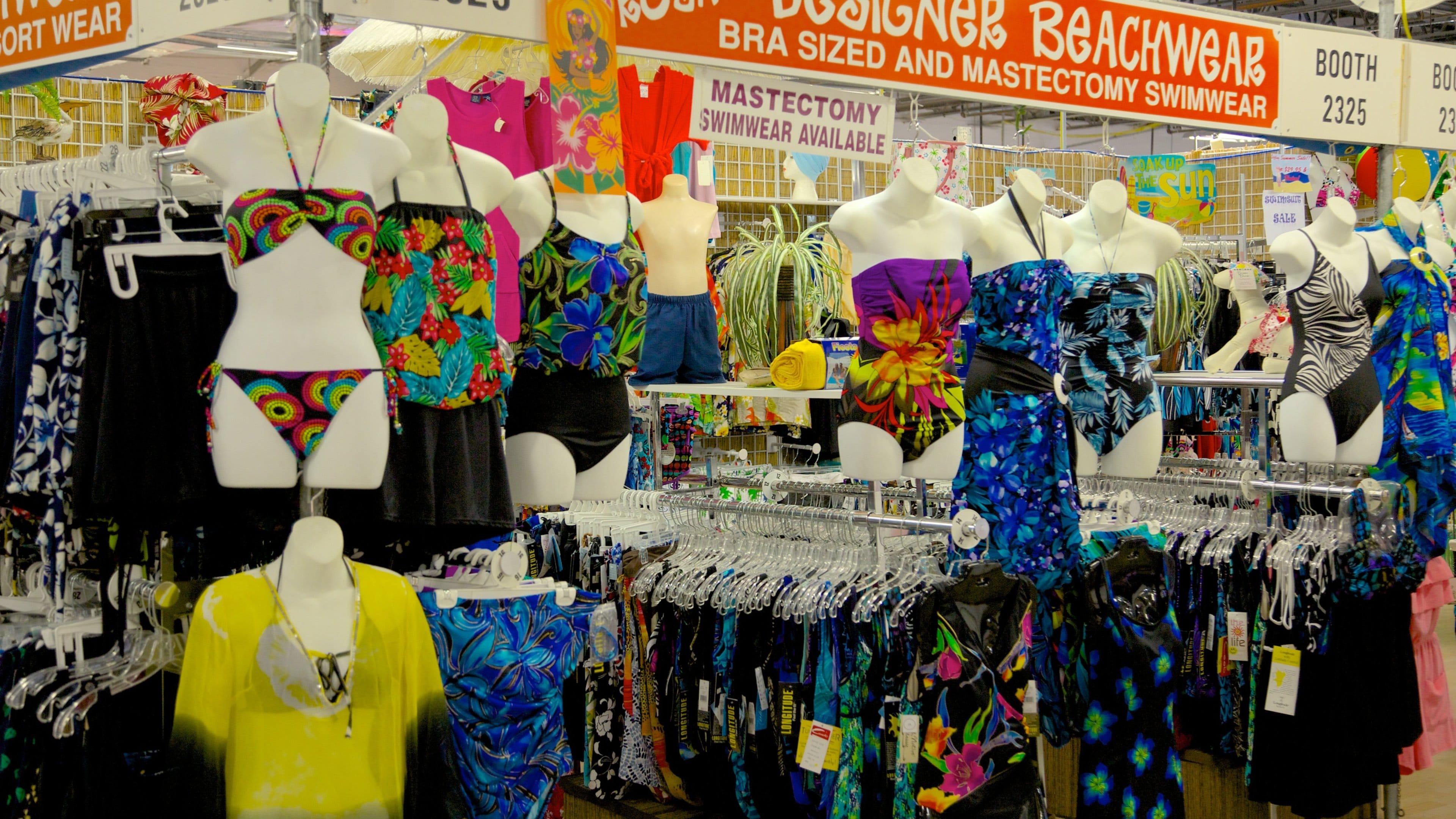 Festival Flea Market showing signage, city views and markets