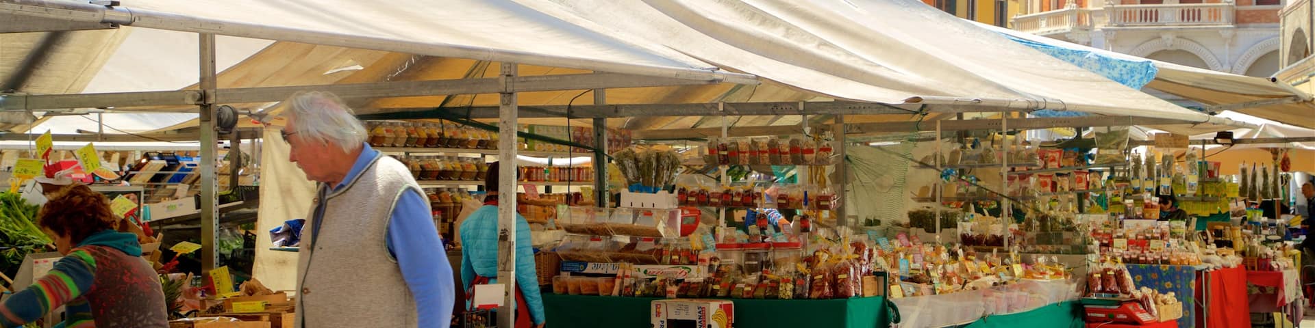 Piazza delle Erbe featuring street scenes and markets as well as a couple