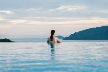 Outdoor pool, open 7:00 AM to 8 PM, pool umbrellas, sun loungers