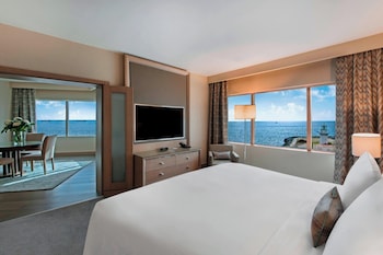 Presidential Suite, 1 King Bed, Sea View | Living room | 49-inch flat-screen TV with cable channels, TV, pay films