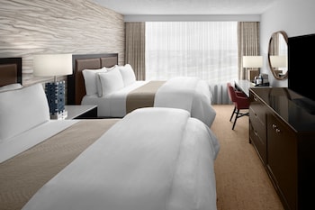 Enter a serene space surrounded by lush greenery and sleek lines.
