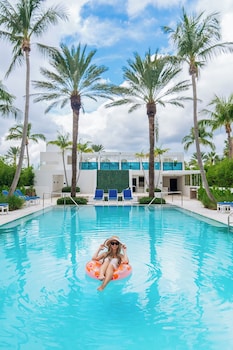 Outdoor pool, open 7:00 AM to 8:00 PM, pool umbrellas, pool loungers