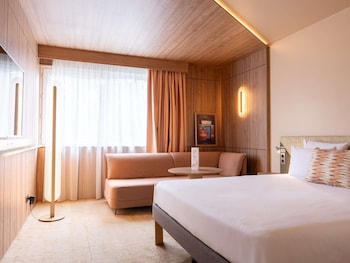 Seasonal outdoor pool, open 9:00 AM to 9:00 PM, pool umbrellas