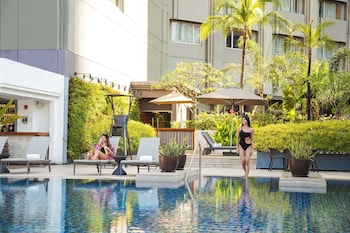 Outdoor pool, open 6:00 AM to 10:00 PM, pool umbrellas, pool loungers