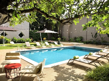 Outdoor pool, open 6:00 AM to 10:00 PM, sun loungers