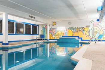 Hypo-allergenic bedding, desk, laptop workspace, blackout curtains