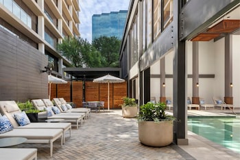 Indoor pool, open 7:00 AM to 10:00 PM, pool umbrellas, sun loungers