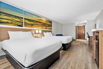 Suite, Multiple Beds, Non Smoking | Desk, laptop workspace, blackout drapes, iron/ironing board