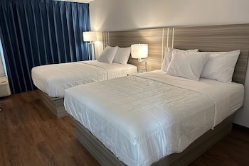 Desk, laptop workspace, blackout drapes, iron/ironing board