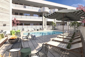 Outdoor pool, open 8:00 AM to 9:00 PM, pool umbrellas, pool loungers