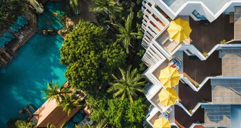 Outdoor pool, open 6:00 AM to 8:00 PM, pool umbrellas