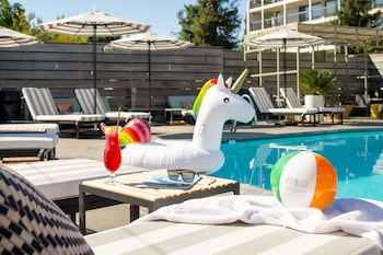 Outdoor pool, open 8:00 AM to 10:00 PM, cabanas (surcharge)