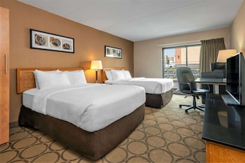 Premium bedding, pillow-top beds, desk, laptop workspace