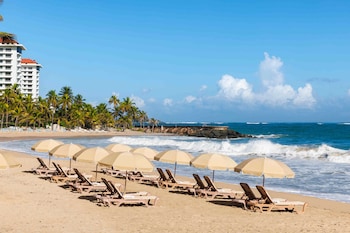 Beach nearby, white sand, sun loungers, beach umbrellas