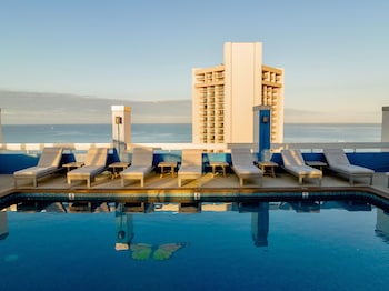 Outdoor pool, open 6:00 AM to 10:00 PM, sun loungers