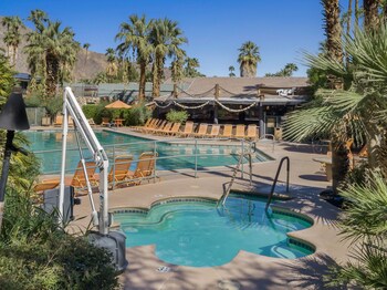 A heated pool, open 8:00 AM to midnight, pool loungers