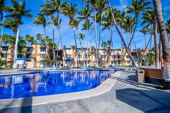 Outdoor pool, open 9:00 AM to 9:00 PM, pool umbrellas, pool loungers