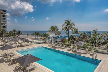 On the beach, sun loungers, beach umbrellas, beach towels