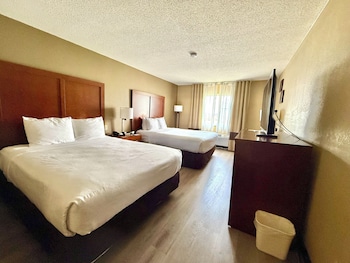 Standard Room, 2 Queen Beds, Non Smoking | In-room safe, desk, laptop workspace, blackout drapes
