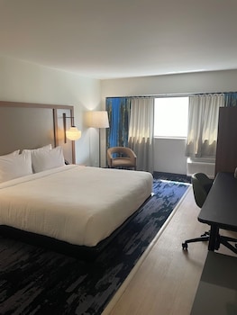 Desk, laptop workspace, blackout curtains, iron/ironing board