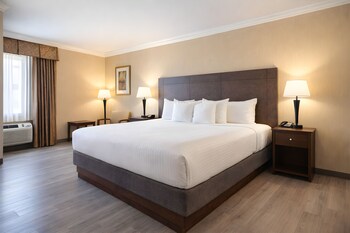 Suite, 1 King Bed, Non Smoking, Jetted Tub | Pillowtop beds, desk, laptop workspace, iron/ironing board