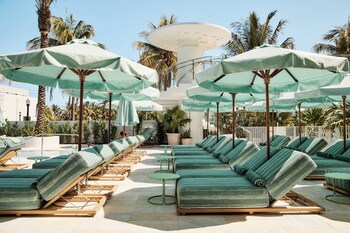 Outdoor pool, open 7:00 AM to 8:00 PM, cabanas (surcharge)