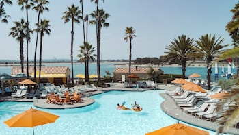 Outdoor pool, open 7:00 AM to 10:00 PM, cabanas (surcharge)