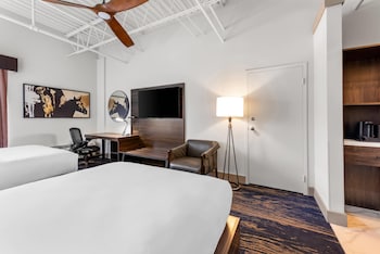 Hypo-allergenic bedding, desk, laptop workspace, blackout drapes