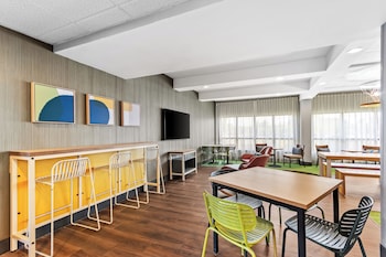 Indoor pool, open 6 AM to 11 PM, pool loungers