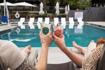 Outdoor pool, open 9:00 AM to 10:00 PM, pool cabanas (surcharge)