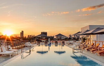 2 outdoor pools, pool umbrellas, pool loungers