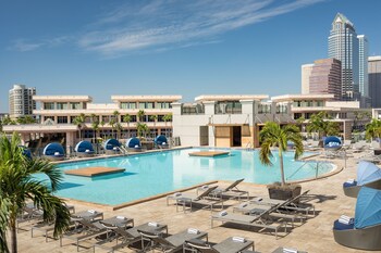 Outdoor pool, open 6:00 AM to 10:00 PM, pool cabanas (surcharge)
