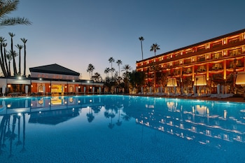 Indoor pool, outdoor pool, pool umbrellas, sun loungers