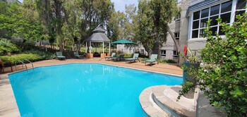 Outdoor pool, open 7:00 AM to 7:00 PM, pool umbrellas, pool loungers