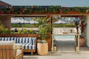 Outdoor pool, open 6:00 AM to 9:00 PM, cabanas (surcharge)
