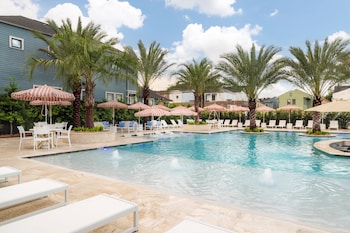 Outdoor pool, open 11:00 AM to 9:00 PM, pool umbrellas, pool loungers