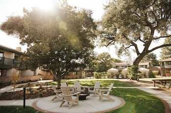 Outdoor pool, open 8 AM to 10:00 PM, free pool cabanas, pool loungers
