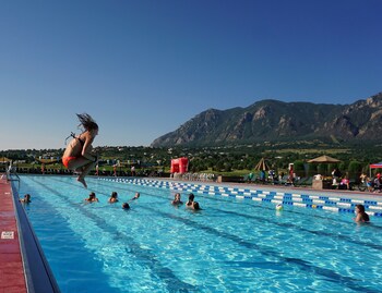 Indoor pool, 2 outdoor pools, open 8:00 AM to 10:00 PM, pool umbrellas