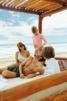On the beach, white sand, beach umbrellas, beach towels