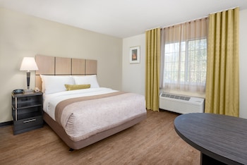 Desk, laptop workspace, blackout drapes, iron/ironing board