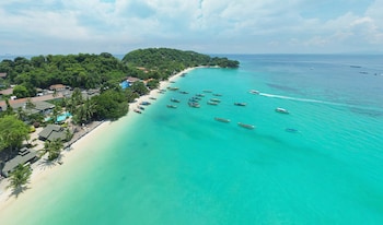 On the beach, white sand, beach towels, scuba diving
