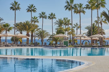 8 outdoor pools, open 9:00 AM to 7:00 PM, pool umbrellas, sun loungers