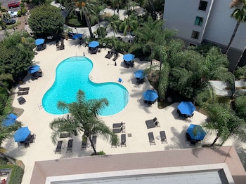 Outdoor pool, open 6:00 AM to 10:00 PM, pool umbrellas, sun loungers