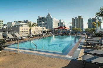 Outdoor pool, open 8:00 AM to 10:00 PM, sun loungers