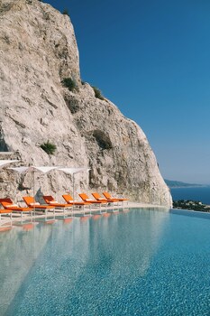 Outdoor pool, open 9:00 AM to 6:00 PM, pool umbrellas, sun loungers