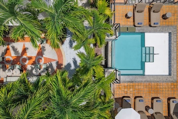 Outdoor pool, open 7:00 AM to 9:00 PM, pool umbrellas, sun loungers