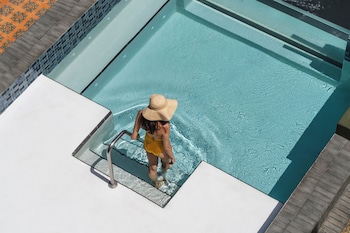 Outdoor pool, open 7:00 AM to 9:00 PM, pool umbrellas, sun loungers