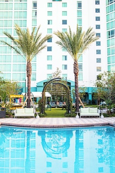 Relax by the pool surrounded by lush greenery and enjoy a refreshing swim.