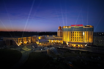 A large hotel with a prominent tower and multiple parking areas.