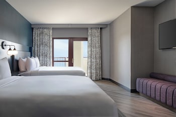 Hypo-allergenic bedding available, pillowtop beds, in-room safe, desk